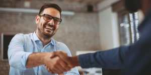 Customer shaking hands with Finance Team | Strongsville, OH