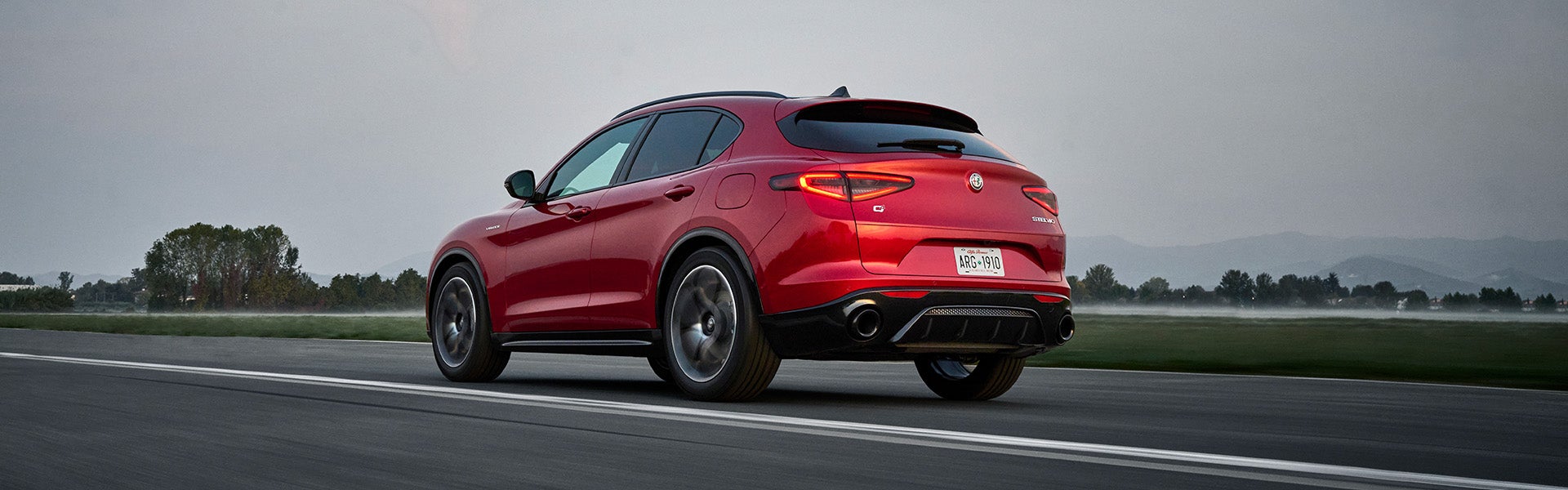 Red 2026 Alfa Romeo Stelvio Running on road 